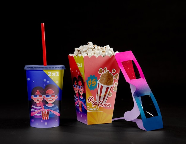 Front view of cinema popcorn with threedimensional glasses