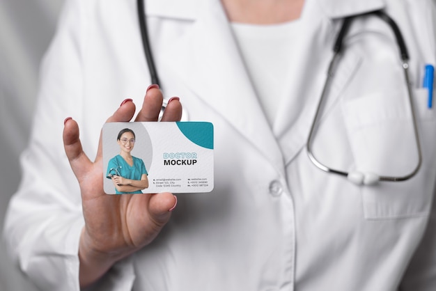 Front view doctor holding card