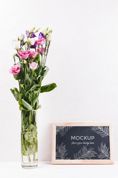 Front view of frame mock-up with vase of flowers