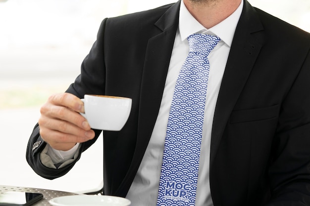 Front view man holding coffee cup