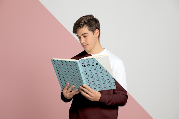 Front view of man reading book