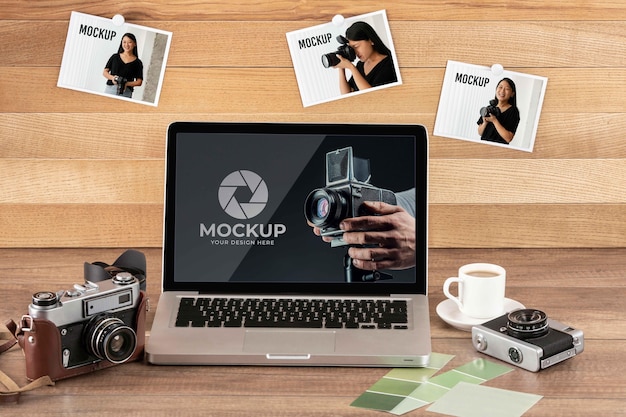 Front view of photographer wooden workspace with laptop