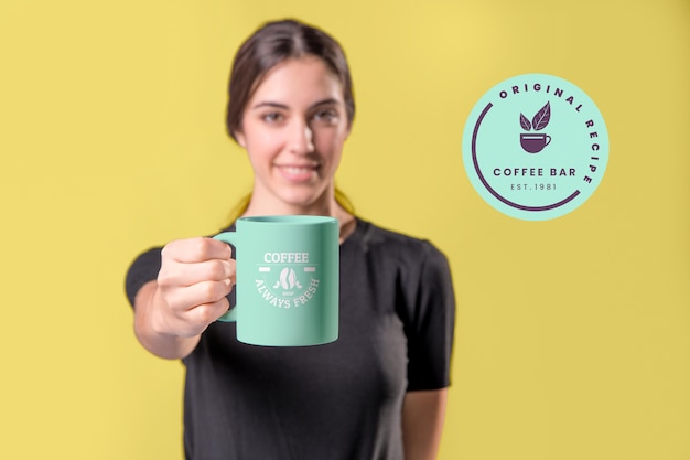 Front view smiley woman with green mug