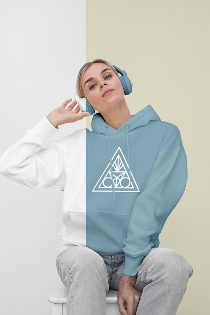 PSD front view of stylish woman in hoodie with headphones