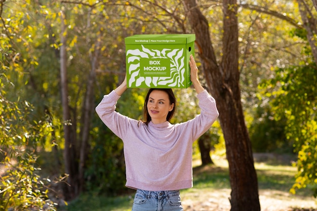 PSD front view woman holding box