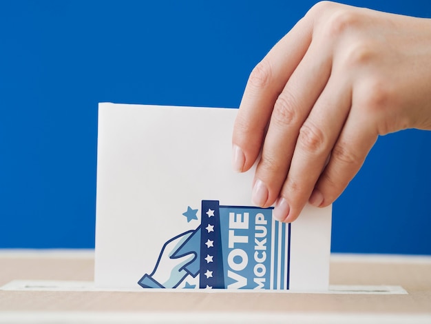 Front view woman putting ballot mock-up in box