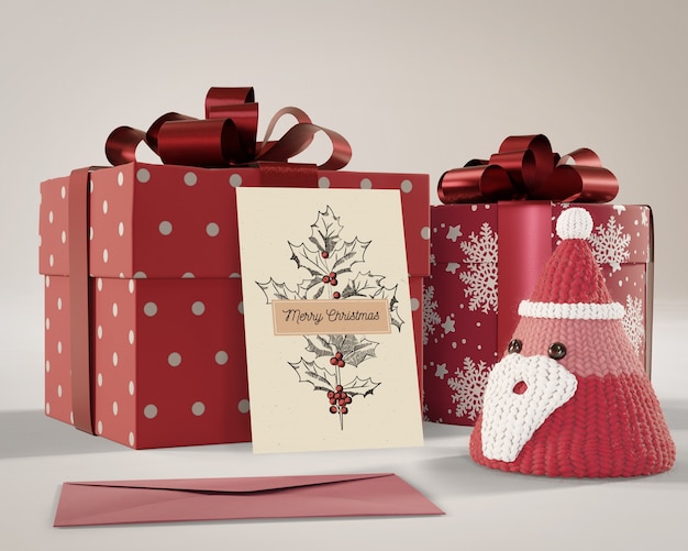 Gifts wrapped in red paper with card on