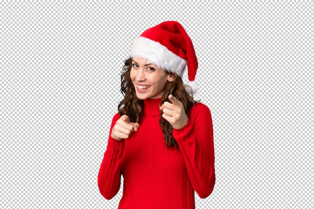 Girl with christmas hat points finger at you