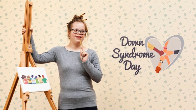 Girl with down syndrome posing with canvas mock-up