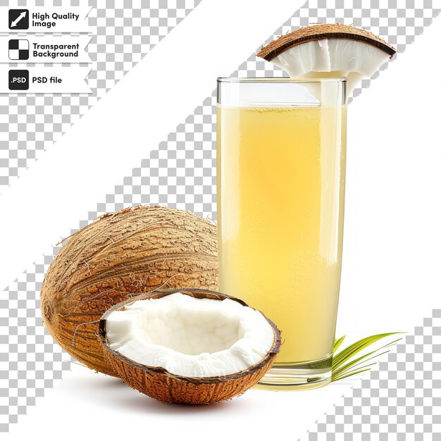 a glass of coconut juice next to a coconut with a coconut in it