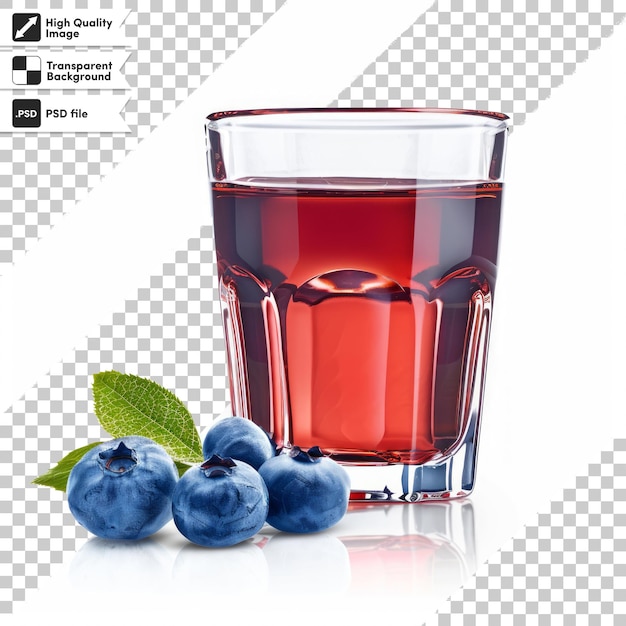 a glass of red liquid next to a blueberries