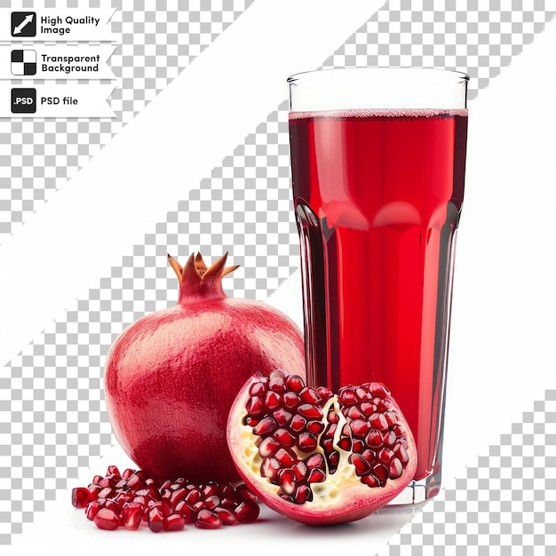 a glass of red liquid next to a pomegranate