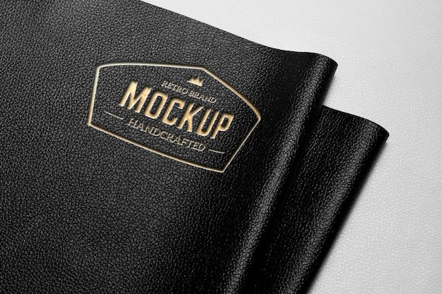 Gold logo on black leather mockup