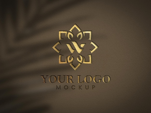 gold logo mockup psd luxurious logo mockup a brown and gold logo with a flower design on it