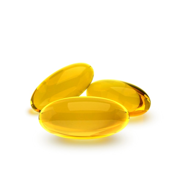 Golden oil capsule of vitamin A E Omega 3 or collagen of medical pill transparent background