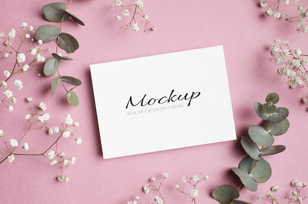 Greeting card mockup with dry eucalyptus and hypsophila flowers