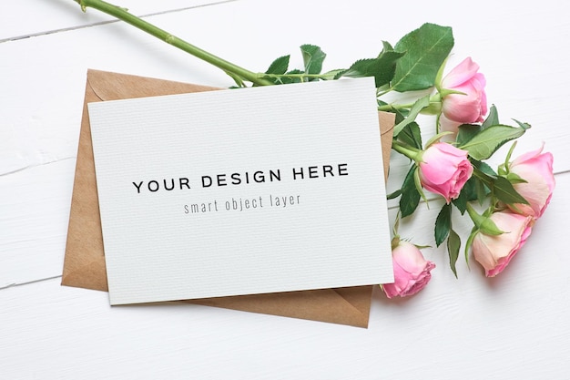 Greeting card mockup with envelope and fresh roses flowers