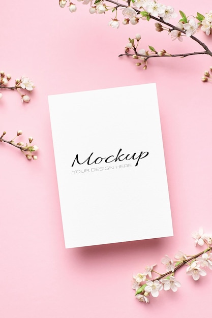 Greeting card mockup with spring cherry blossom flowers twigs