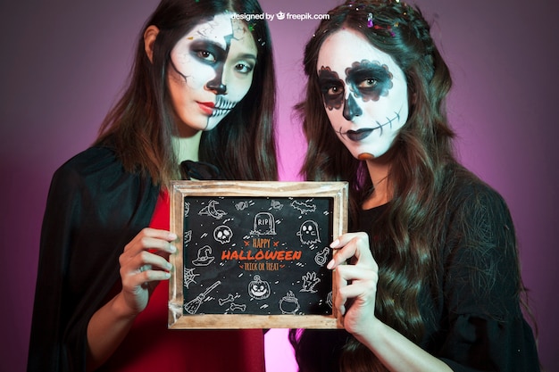 Halloween mockup with women holding slate