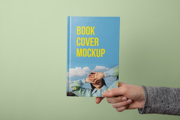 PSD hand holding  book mockup