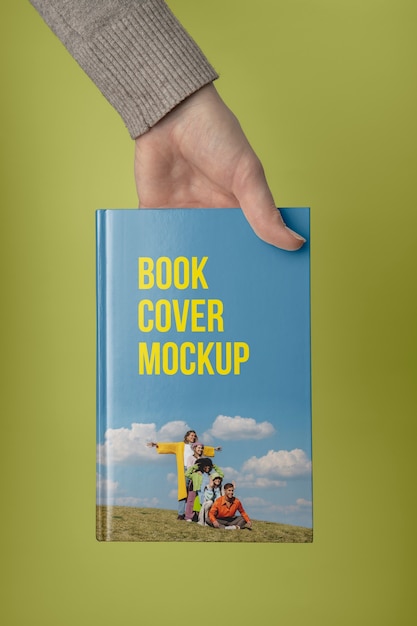 Hand holding  book mockup