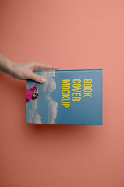 PSD hand holding  book mockup