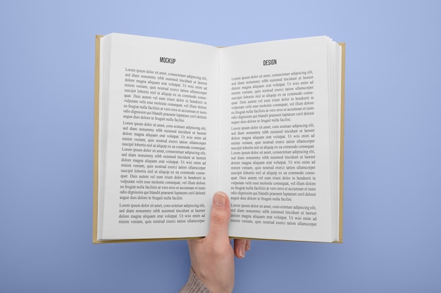 Hand holding  book mockup