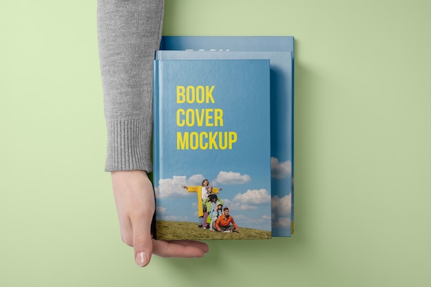 Hand holding  book mockup