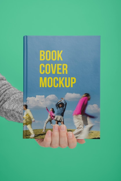 Hand holding  book mockup