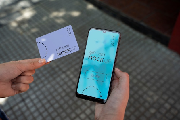 Hand holding gift card mockup