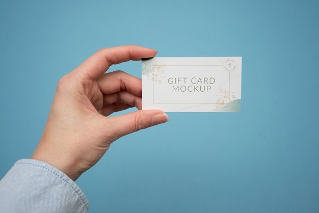 Hand holding gift card  mockup