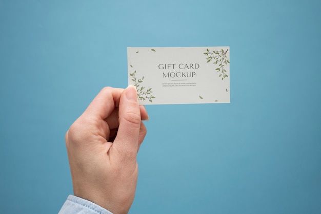 Hand holding gift card  mockup