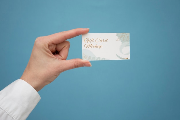 Hand holding gift card  mockup