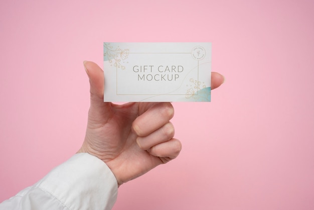 Hand holding gift card  mockup