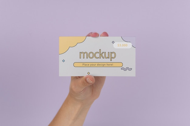 Hand holding gift card mockup