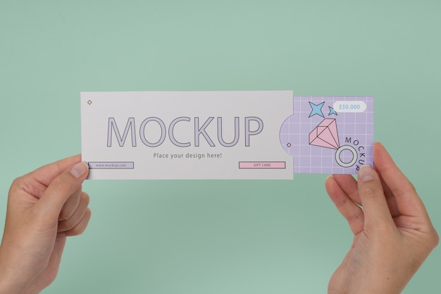 Hand holding gift card mockup