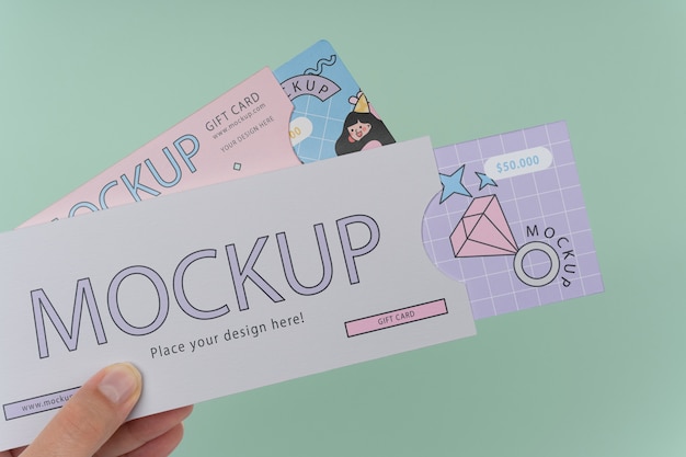 Hand holding gift card mockup