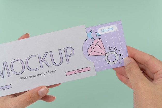 Hand holding gift card mockup