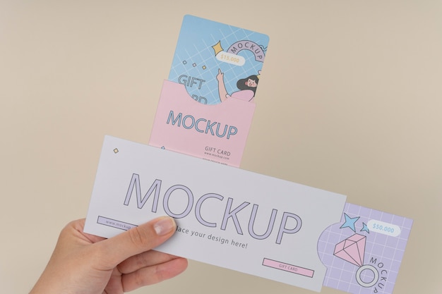 Hand holding gift card mockup