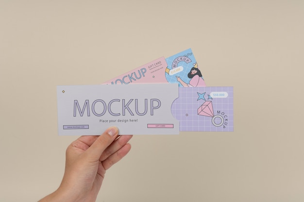 Hand holding gift card mockup