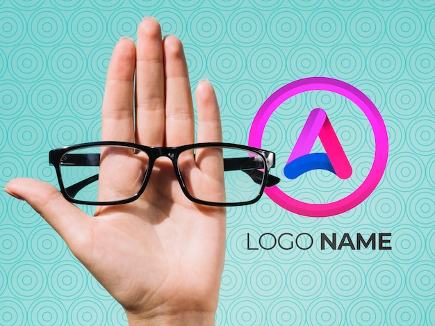 Hand holding glasses and logo name design