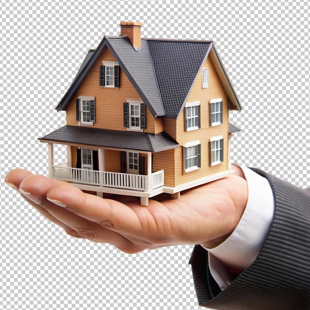 PSD hand holding a small simple house on isolated transparent background