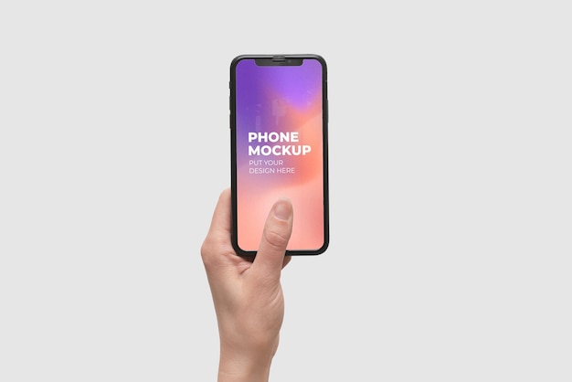 Hand holding smartphone device mock-up on color background