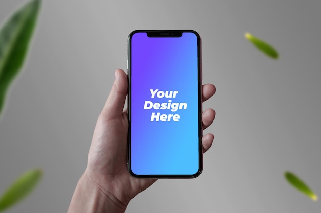 Hand holding smartphone mockup PSD on mobile phone screen