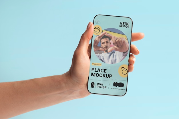 Hand holding smartphone mockup