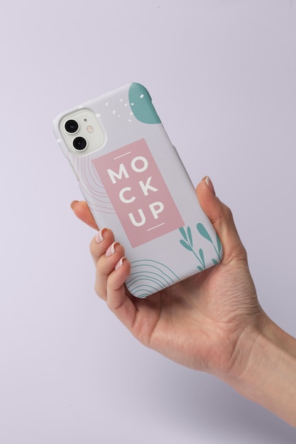 PSD hand holding smartphone with mock-up phone case