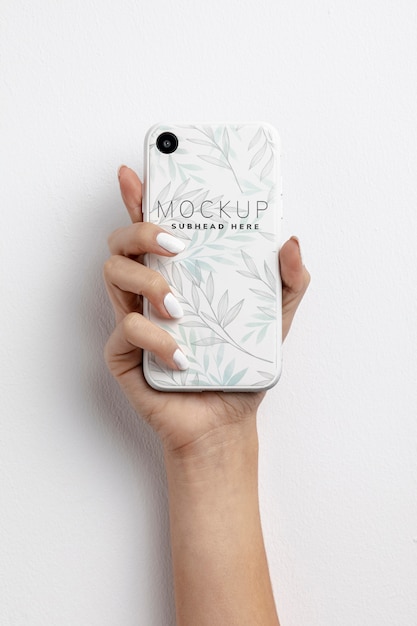 Hand holding smartphone with mockup