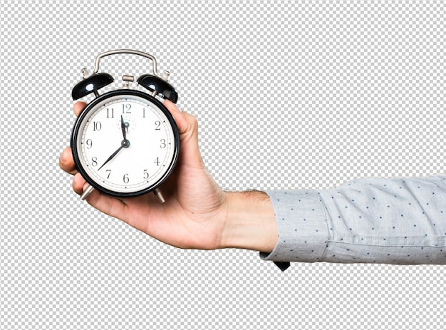 Hand of man holding vintage clock