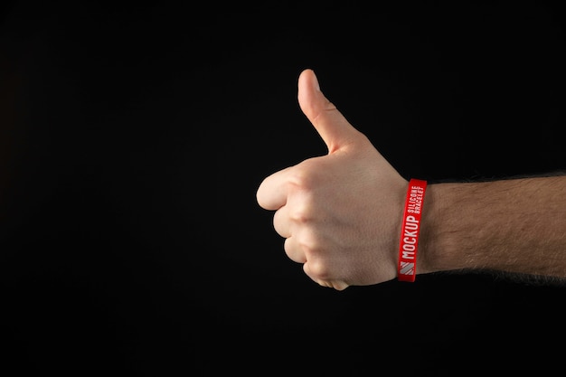 Hand wearing red bracelet mockup