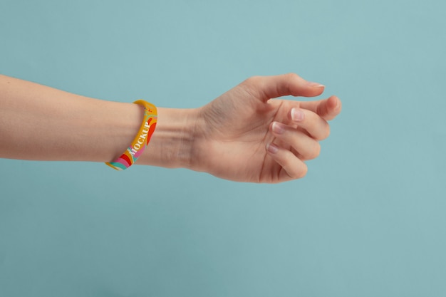 Hand with mock-up music fest bracelet